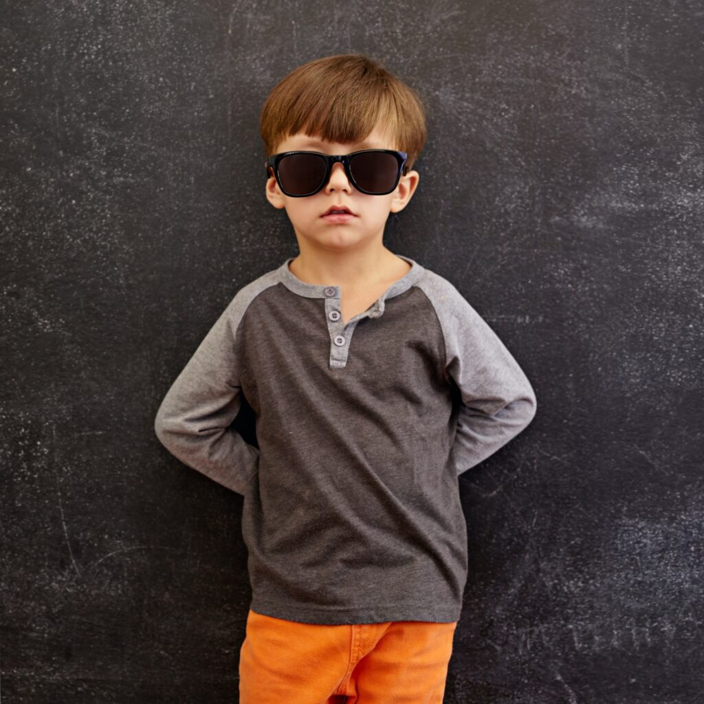 Innocent little kid wearing sunglasses